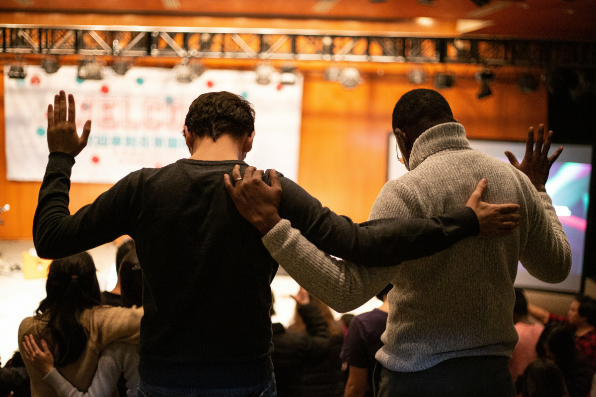 Two men worshipping together